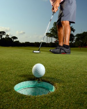 Golfer on a course golfing clipart