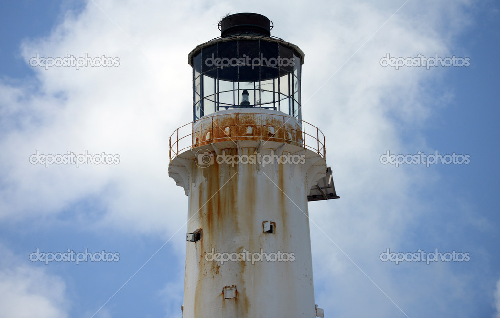 a close up image of the light at tthe top of a lighthouse