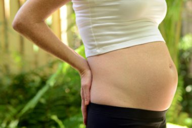 pregnancy backache or back pain clipart