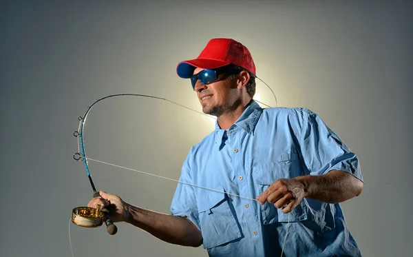 Pescador e cana de pesca — Fotografia de Stock