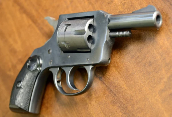 Handgun on wood background — Stock Photo, Image