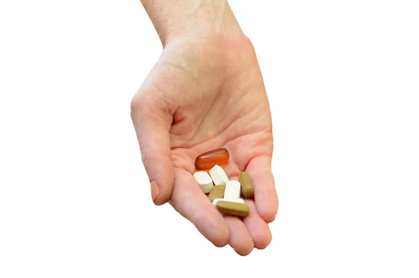 Hand holding daily vitamins or medicine on white — Stock Photo, Image