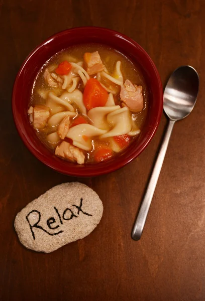 Relaxing and chicken noodle soup — Stock Photo, Image