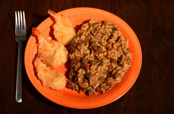 Fried shrimp and hearty rice dish — Stock Photo, Image