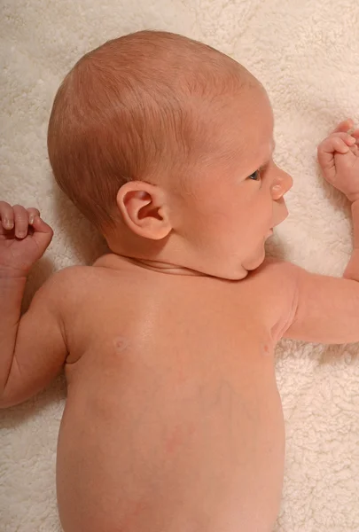 Baby on white blanket — Stock Photo, Image