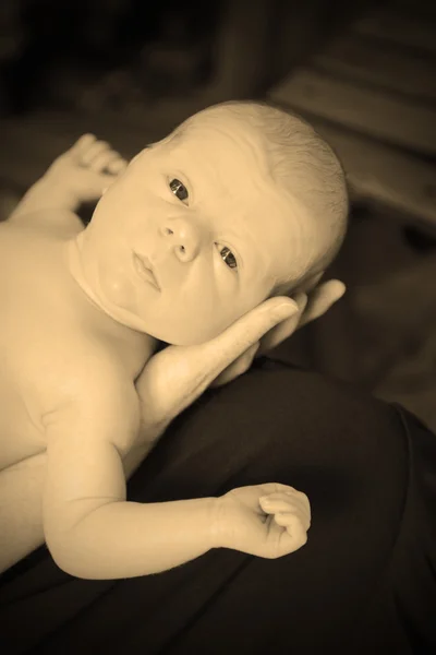 Young baby and mother in sepia — Stock Photo, Image