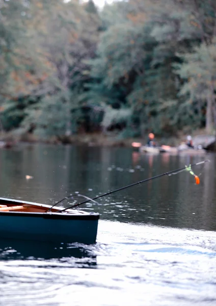 Fishing in a canoe in autumn in maine — Stock Photo, Image