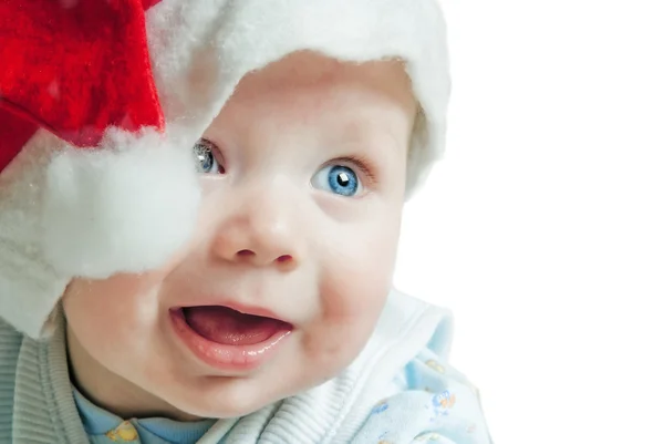 Portret van een baby in een kerst hoed sata claus — Stockfoto