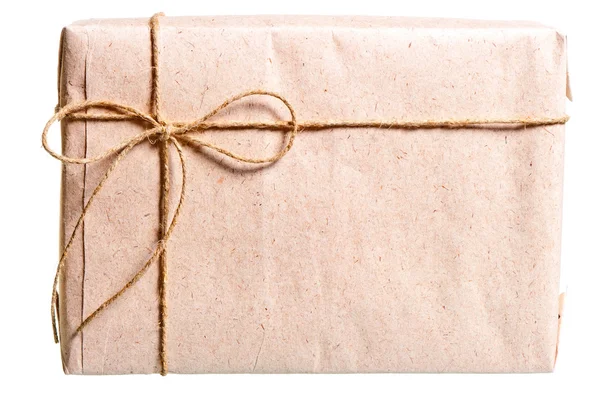 Parcel wrapped in brown paper and tied with twine — Stock Photo, Image