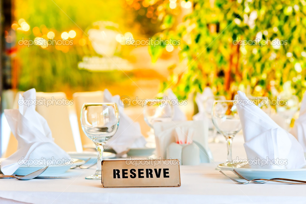 beautifully laid for supper table with a sign reserved