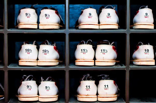 Rack with shoes for bowling in different sizes — Stock Photo, Image