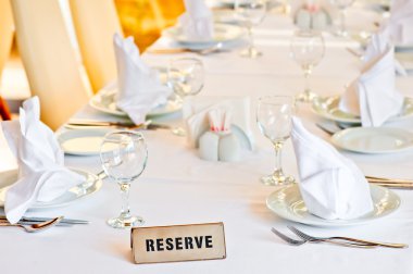 beautifully set table is reserved for guests of the restaurant clipart