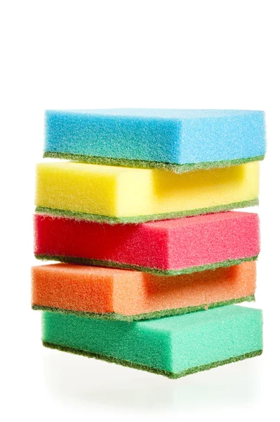 A pile of sponges for washing dishes of different colors on a white — Stock Photo, Image