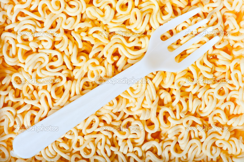 disposable fork on instant noodles close up