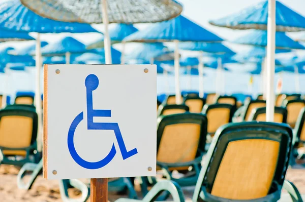 Sign wheelchair close-up on the beach — Stock Photo, Image