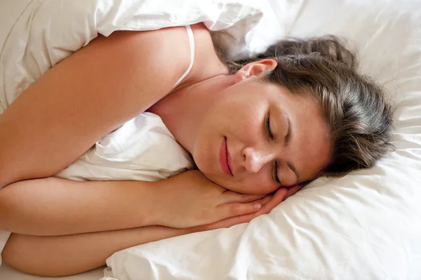 Girl is sleeping his hands behind his cheek — Stock Photo, Image