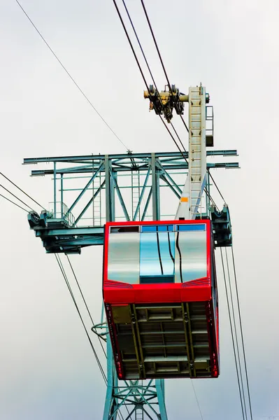 Red cabin of a chair lift at Mount Tahtal. — Stock Photo, Image