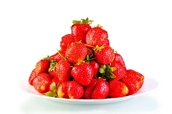 Pile of garden strawberry on a plate isolated — Stock Photo, Image