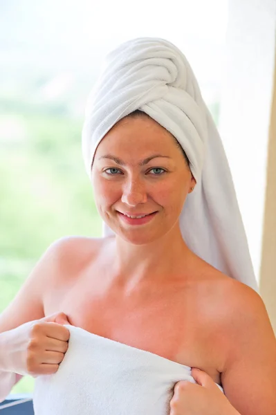 Smiling girl in a towel after bath — Stock Photo, Image