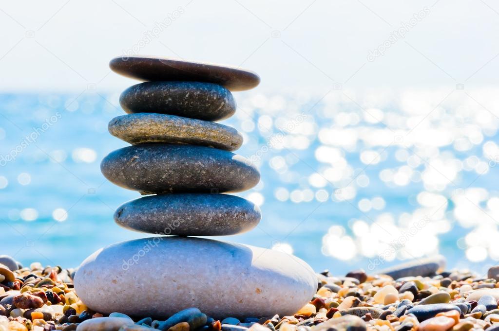 oval pile of stones on the beach