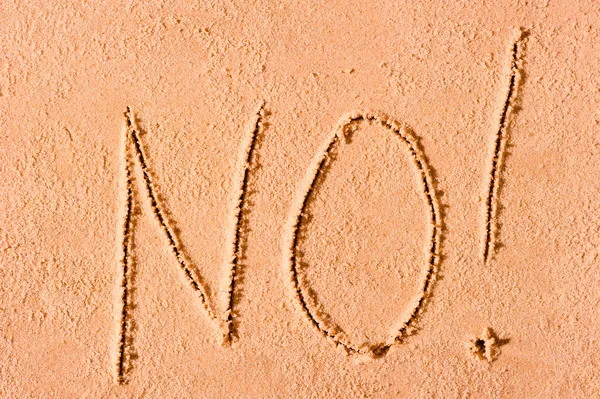 NO escrito en arena mojada en el mar — Foto de Stock