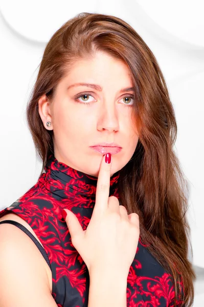 Beautiful sad offended girl in studio — Stock Photo, Image