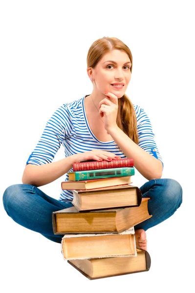 Brunette with a stack of books to learn the subject — Stock Photo, Image