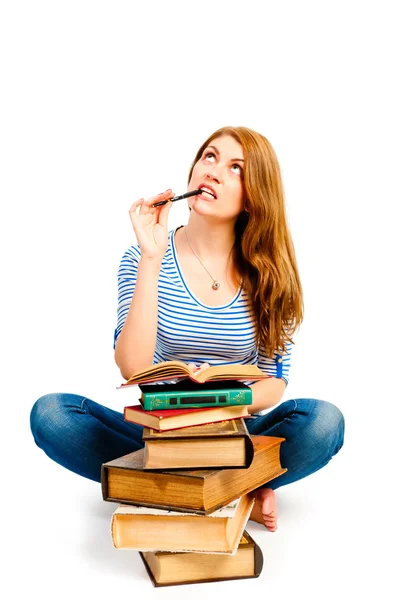 Meditate beautiful student with a pile of books — Stock Photo, Image