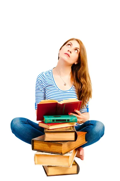 Thoughtful student and pile of books — Stock Photo, Image