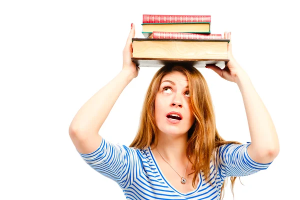 Beautiful girl student with books on her head — Stock Photo, Image