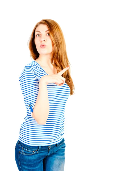 Beautiful girl on a white background in the studio shows — Stock Photo, Image