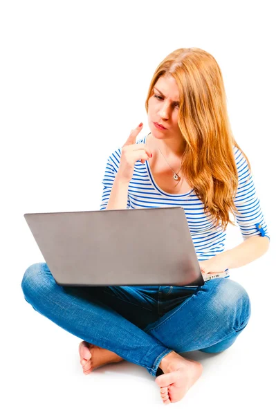 Woman with laptop sitting on a white background — Stock Photo, Image