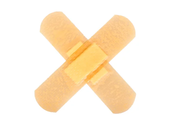 Dois band-aid sob a forma de uma cruz colada — Fotografia de Stock