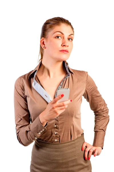 Beautiful girl with a phone in his hand in the studio — Stock Photo, Image