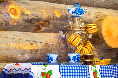 traditionally shining Russian samovar on the table clipart