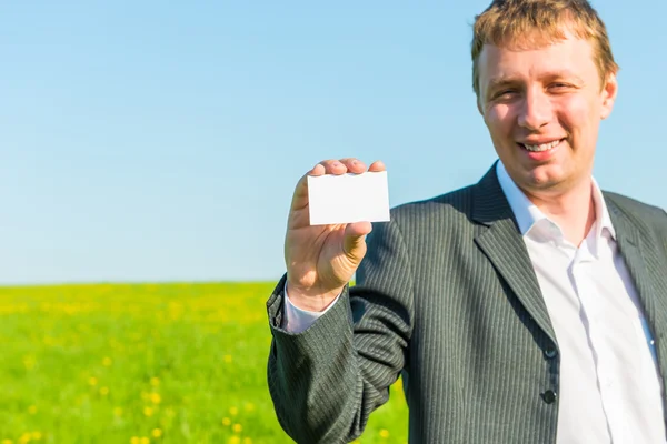 Clean business card in hand of a successful businessman — Stock Photo, Image