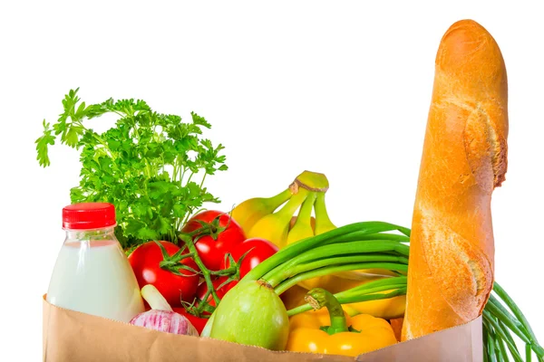Limpa bröd, mjölk och grönsaker i paketet på vita backg — Stockfoto