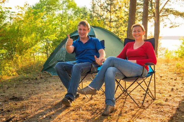 Happy and cheerful couple camping on the nature — Stock Photo, Image