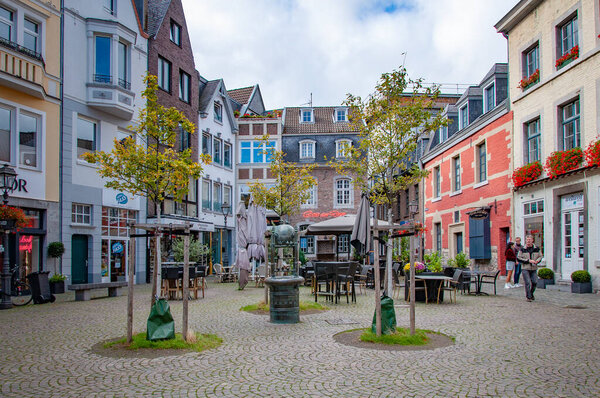 AACHEN, GERMANY. OCTOBER 04, 2020. Cozy yard with trees and beautiful houses. Eupropean architecture