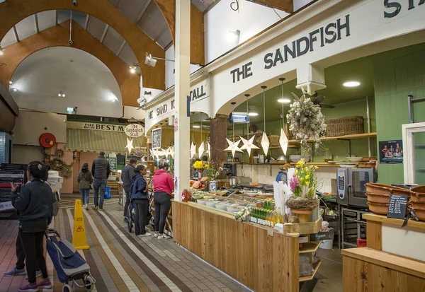 CORK, IRELAND. APRIL 19, 2022. English Market. Shops and people buying some food.