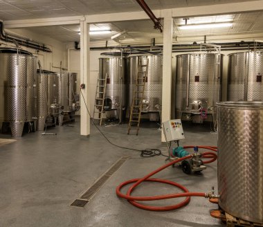 Monthelie, France - June 30, 2020: Stainless steel wine barrels in the winery Les Hauts Bins in Monthelie in burgundy, France.