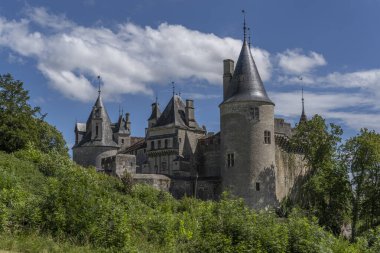 Castle La Rochepot in the village of La Rochpot with hills and nature, France.