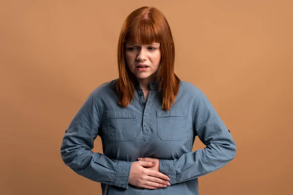 Portrait Unhappy Ill Woman Ginger Hair Standing Holding Her Belly — Foto Stock