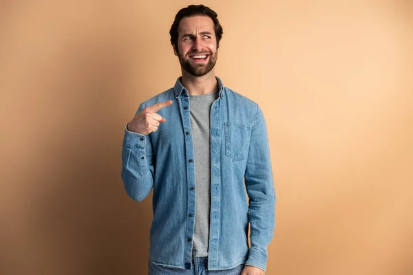 Positive Bearded Man Pointing Finger Away Funny Face Empty Space – stockfoto