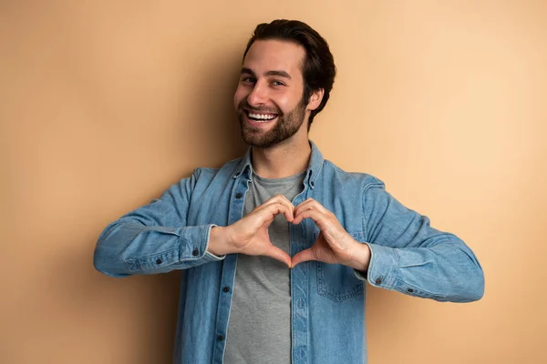 Romantic Enamored Man Beard Looking Camera Made Heart Fingers Showing — Zdjęcie stockowe