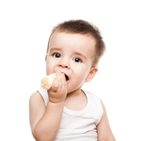 Bambino che mangia frutta sana Foto Stock