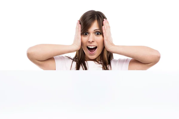 Portrait of a young woman with blank billboard — Stock Photo, Image