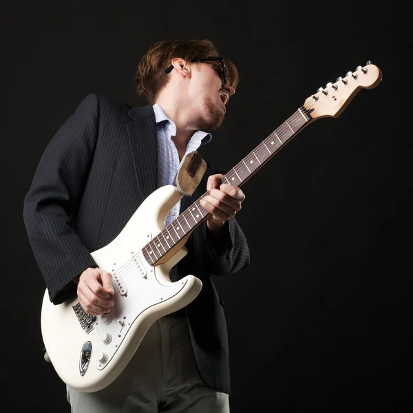 Handsome young man with electric guitar — Stock Photo, Image