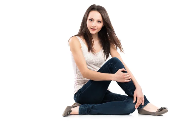 Attractive caucasian girl sitting on floor — Stock Photo, Image