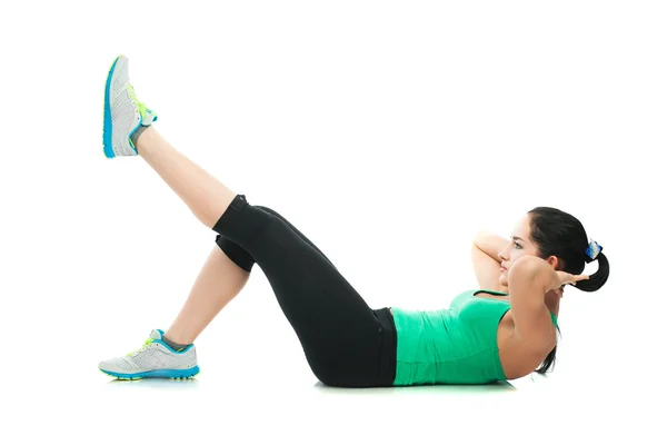 Bela mulher esportiva fazendo exercício no chão — Fotografia de Stock